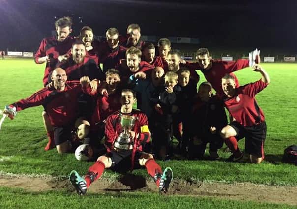 Rye Town Football Club celebrates after winning the Hastings & District FA Junior Cup.