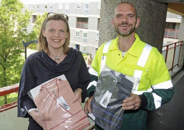 Claire Robinson, from Inga Wellbeing, with Paul Green who found stolen clothes destined for cancer patients that had been dumped near Gunwharf Quays