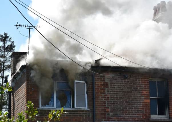 Firefighters tackling a blaze at a derelict house in Swanley Close in Eastbourne, by Langney Shopping Centre. Picture: Dan Jessup