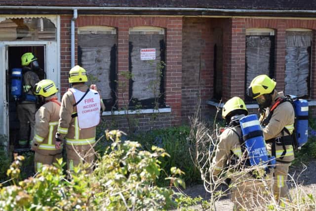 Firefighters tackling a blaze at a derelict house in Swanley Close in Eastbourne, by Langney Shopping Centre. Picture: Dan Jessup