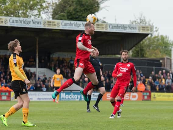 Mark Connolly with a defensive header. Picture by Simon Lankester