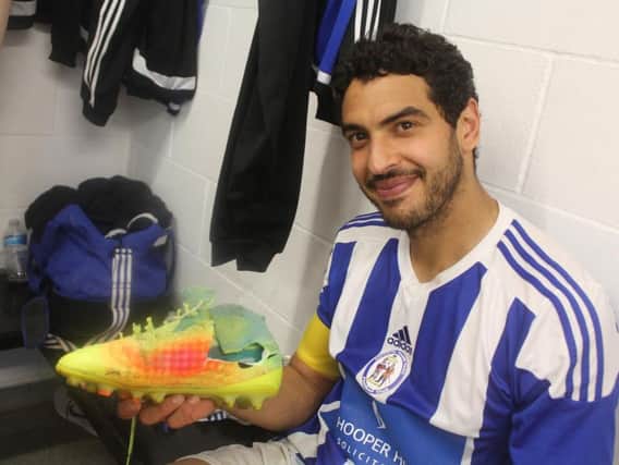 Skipper Naim's boot had to be cut free after ankle injury. Picture by Colin Bowman
