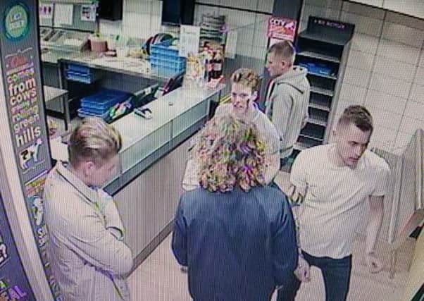 Police would like to speak to these men in connection to a violent high street assault in Horley. Picture: Surrey Police