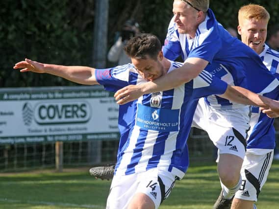Haywards Heath Town players celebrate a goal. Picture by Derek Martin