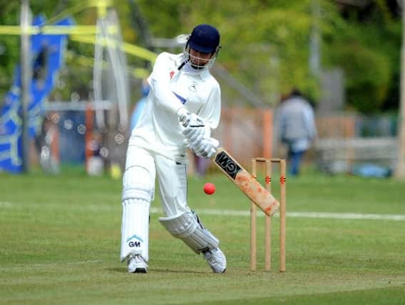 Tom Hinley hits out during his 31 not out. Picture by Steve Robards