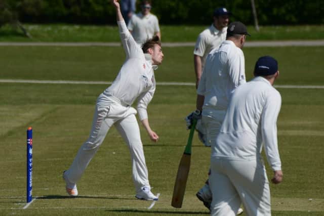Bexhill spinner Josh Beeslee in his delivery stride. Picture courtesy Andy Hodder