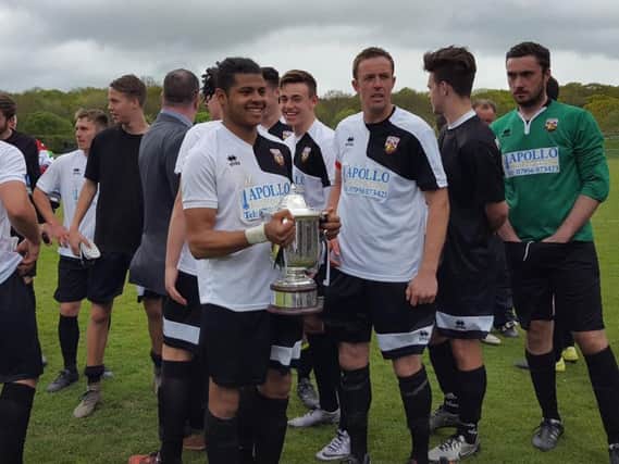 Pagham players with the trophy.