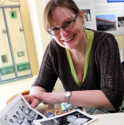Sheila Marsden, honary curator of the Rustington Heritage Association with some of the old photographs on display in the exhibition  ks170853-5