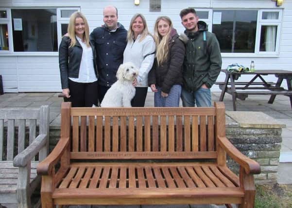 Millie (centre) with Hannah, Nathan, Ruby and Elliot next to the  bench in Steyning Cricket Club