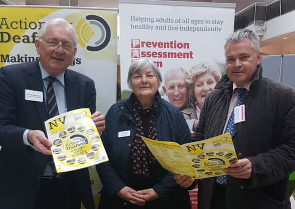Sir Peter Bottomley and Tim Loughton with Gerry Turton from Action for Deafness at the Pensioners' Fair