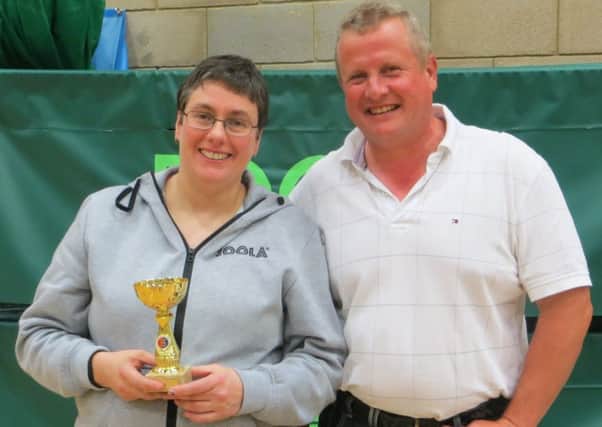 Women's singles champion Rose Rainton with Hastings & District Table Tennis Association president Robin Gibbs. Picture courtesy Mick Lane