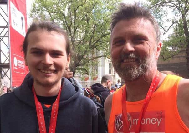 Father and son Phil and Ben Clarke after finishing the London Marathon