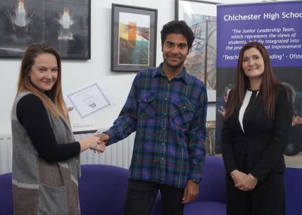 Jade Reidy, human resources and customer relations manager at South Link, left, presents a Samsung Galaxy tablet to Chichester High School student Joss Edwards, watched by Vickie Smith, head of sixth form