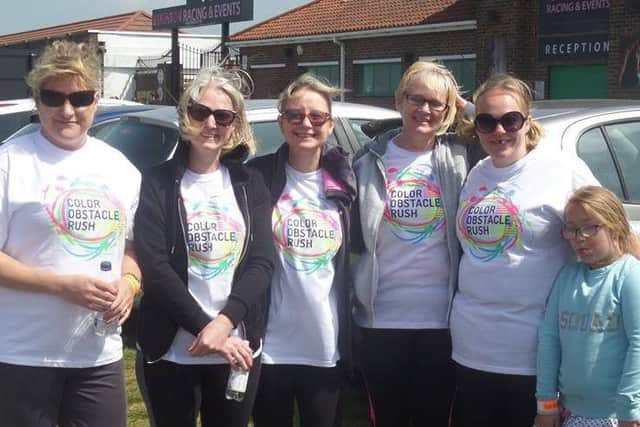 Homecall  scheme manager Leah Norman (second from left)  and supporters who took part in the Brighton 5K Color Obstacle Rush SUS-170805-112123001