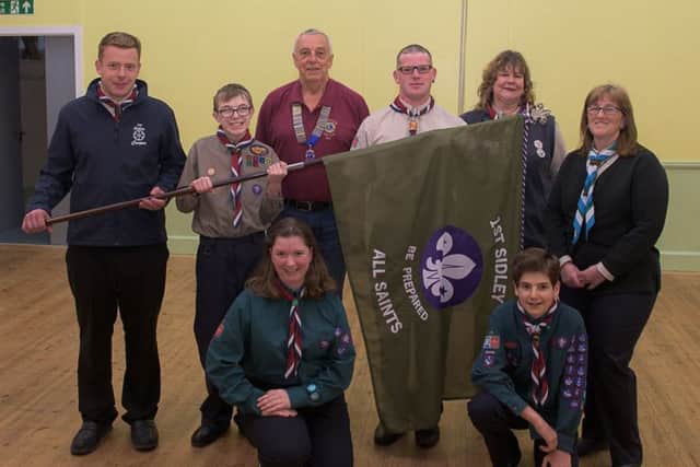 Bexhill Lions President Rick Hough presents the Explorer Scout Unit at 1st Sidley (All Saints) Scout Group with its own flag. SUS-170805-123648001