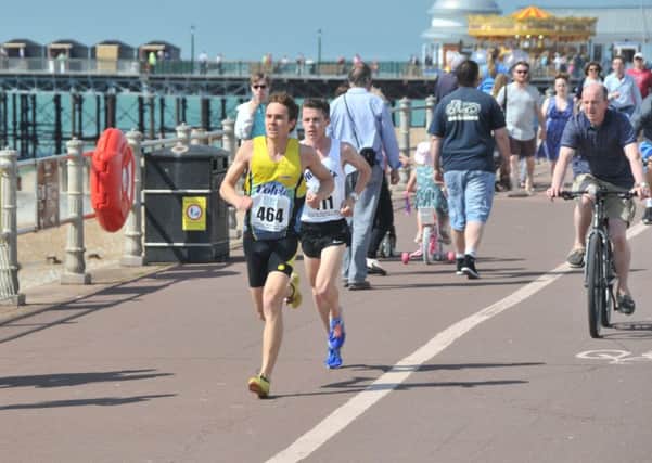 Ross Skelton and Christopher Zablocki battling it out on the seafront at the front of the 2016 Hastings Runners 5-Mile Race.