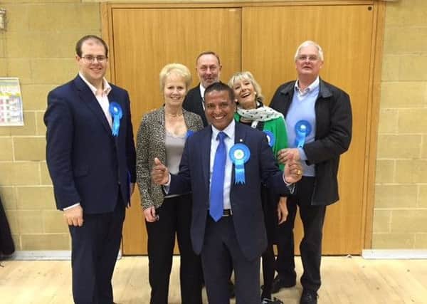 Sujan Wickremaratchi celebrates the Tories' county council election success with colleagues