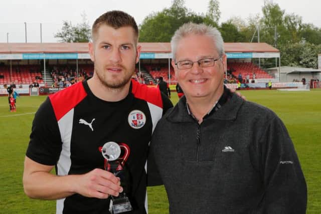 Crawley Observer sports editor Graham Carter presents their Crawley Town Player of the Year Award to James Collins before their 2-2 draw with Mansfield Town.
Picture by James Boardman, Telephoto Images.