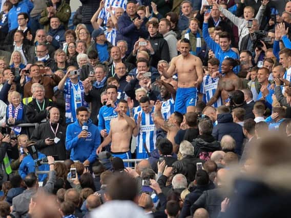 Brighton's players and fans celebrate promotion. Picture by Phil Westlake (PW Sporting Photography)