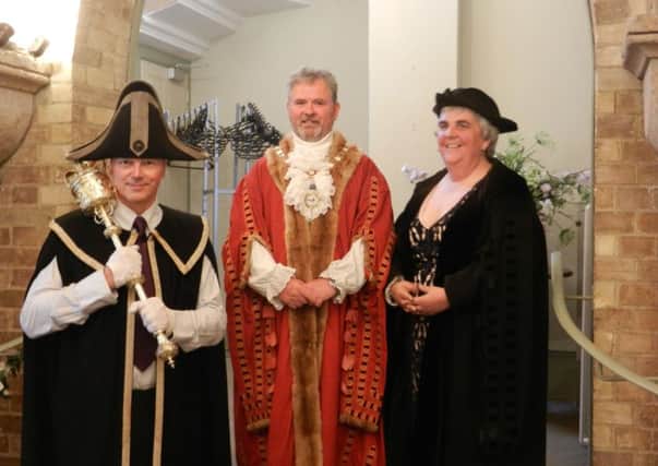 New mayor Angela Standing (right) with former mayor James Stewart (centre) before the changover