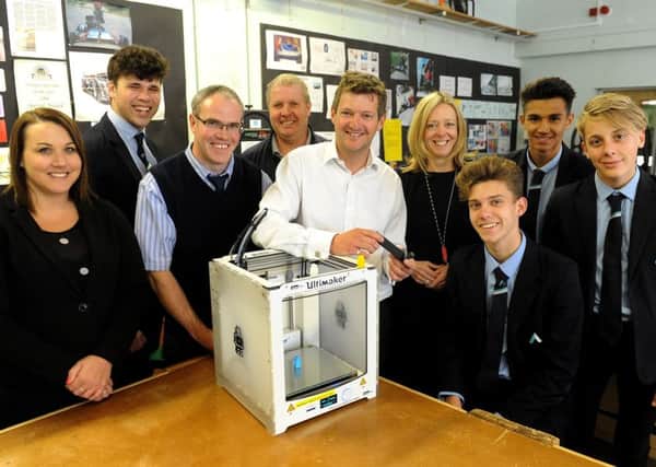 Andrew Baldwin, engineering manager for Parker Kittiwake, demonstrates the 3D printer they have given to The Angmering School in Station Road, Angmering. Picture: Steve Robards