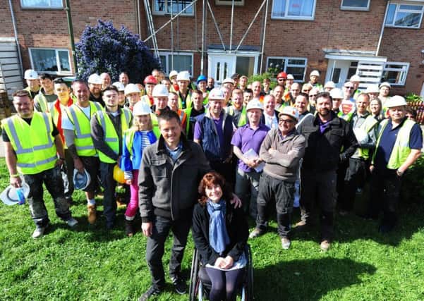 Amanda and Vic Worne with Nick Knowles and the DIY SOS team and some of the volunteers. ks170899-1 SUS-170905-182607008