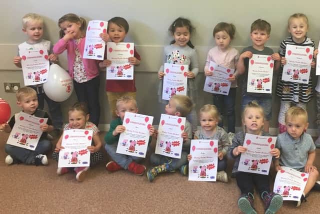 Members of Little Explorers Pre-school with their certificates