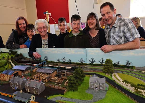 Lois Dedman, third left, shows her family and grandchildren her late husband Ted's railway layout, which was on show at Sompting and District Model Railway Club's annual exhibition for the first time. Picture: Stephen Goodger