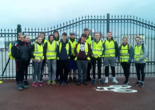 Cameron Stockley-Pollard, centre, with classmates on the Hastings Pier to Brighton Pier sponsored walk