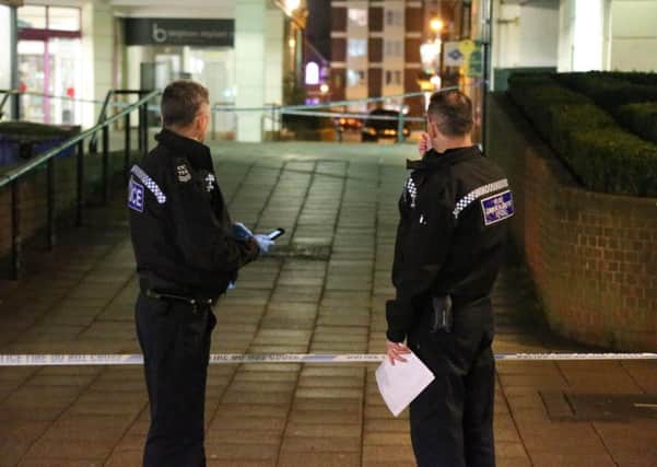 Officers at the crime scene in February. Picture: Eddie Mitchell