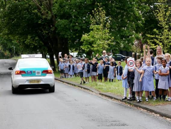 Children highlighting the 20mph area to drivers (Photograph: Stephen Lawrence)
