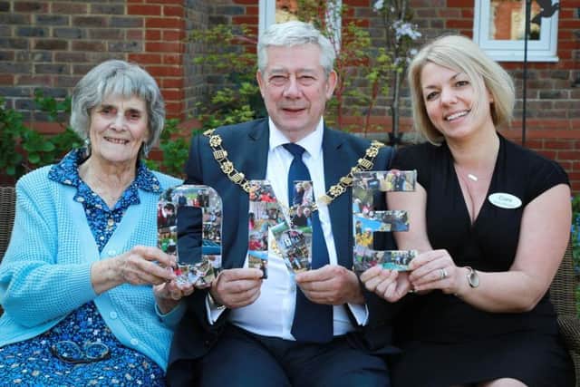 Chichester Mayor Peter Budge; home manager Clare Gibson (right) and resident Irene Allen celebrate the first birthday of Colten Care's Wellington Grang