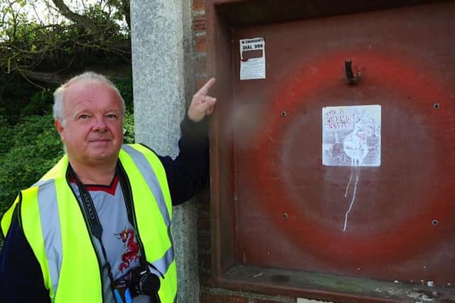 Clive Fennell, chairman of the Friends of Mewsbrook Park, with a stolen life buoy. Picture: Stephen Goodger