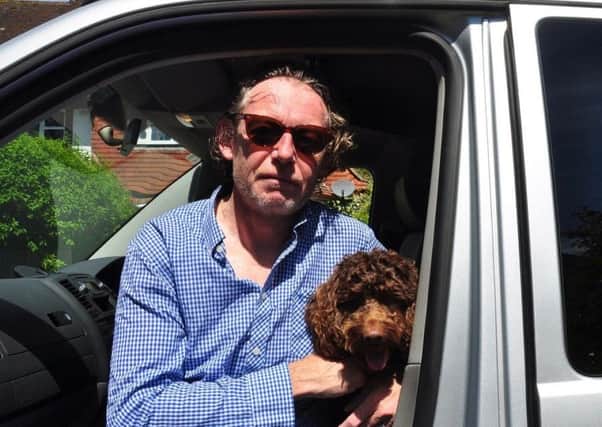 Filmmaker Ben Bowie in his campervan with his dog, Monte