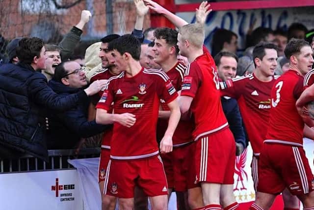Worthing supporters celebrate with the players. Picture by Stephen Goodger