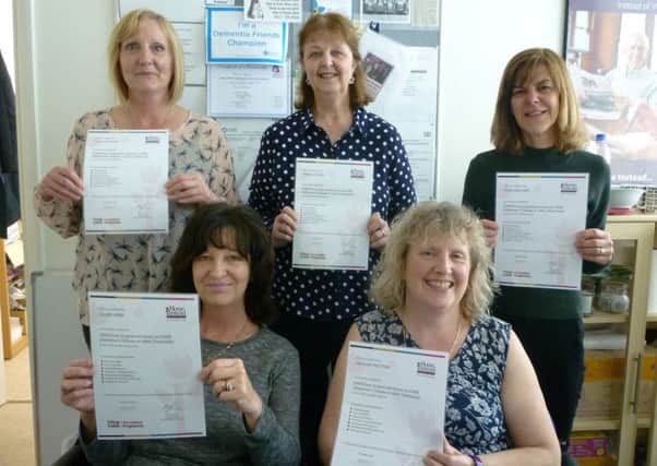 Staff from Home Instead Senior Care with their certificates