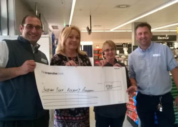 Joss Loader was presented with a cheque by staff at the Ham Road Co-Operative shop SUS-170518-152643001