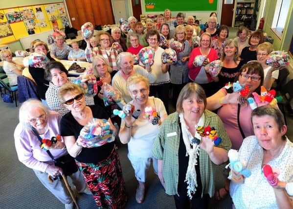ks170920-1 LG Knitted Smoothie Hat  phot kate
Members of the Arcade Knitters in Littlehampton handed over their bags of hats to Dianne Henderson, chief executive fom Age UK, front second right.ks1709201-1 SUS-170521-165906008