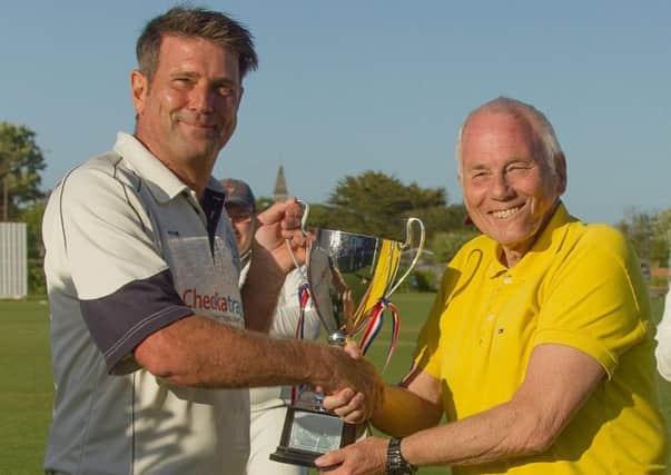 Bob Hoare presents the trophy to Tig Hoare
