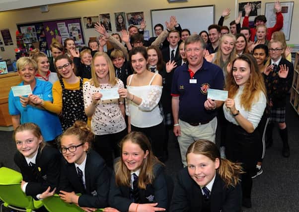 The cheque presentation at Felpham Community College following a hugely successful charity week. Pictures: Stephen Goodger