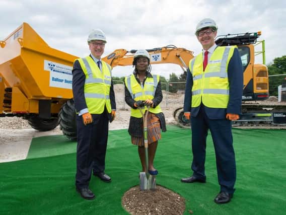 Professor Michael Davies, Pro-Vice-Chancellor (Research) at the University of Sussex, current student resident Vita Obeng and David Swarbrick, managing director of Balfour Beatty, break the ground to officially mark the start of construction work on a new student village