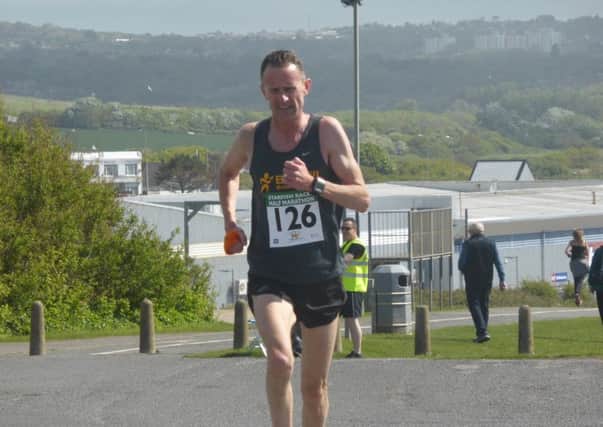 Half marathon runner-up Otto Haas reaches the top of Galley Hill en route to finishing second in the half marathon at the 2017 Bexhill Starfish Races. Pictures by Simon Newstead