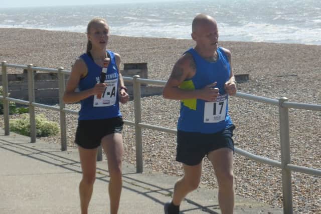 Stacey Clusker and marathon runner-up Paul Gault make their way along the lower promenade.