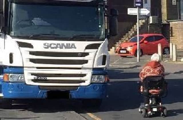 A car transporter parked on the pavement in Courtlands Road forced a disabled person into the road