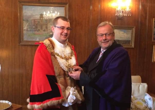 Worthing mayor making 2017. Councillor Sean McDonald hands over the duty to Alex Harman, Worthing's youngest mayor. SUS-170519-142244001