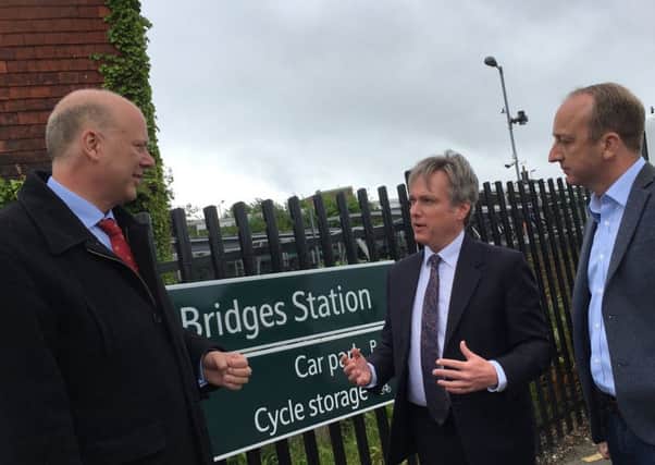 Transport Secretary Chris Grayling with Tory candidate for Crawley Henry Smith at Three Bridges Railway Station