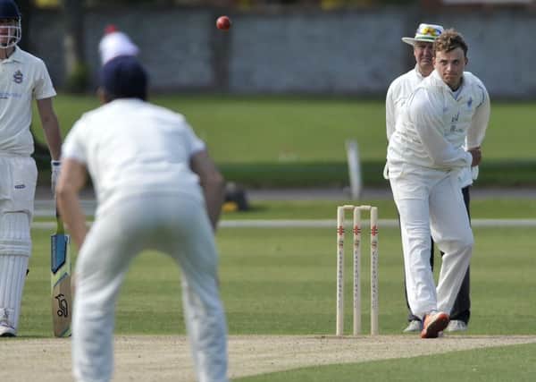 Billingshurst overseas Ed Verrall takes to the bowling attack against Eastbourne. Picture by Mark Dimmock