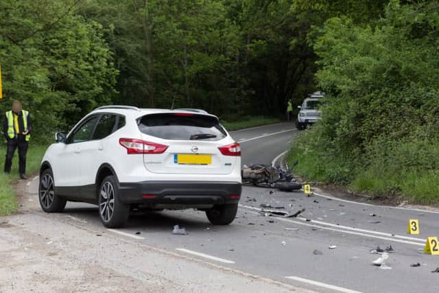 Debris is scattered across the road following a serious RTC involving a motorbike and car in Wivelsfield. Picture by Nick Fontana. SUS-170521-124044001