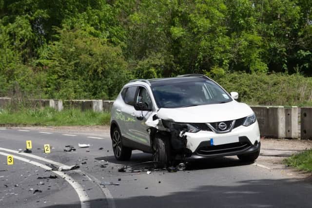 Debris is scattered across the road following a serious RTC involving a motorbike and car in Wivelsfield. Picture by Nick Fontana. SUS-170521-124032001