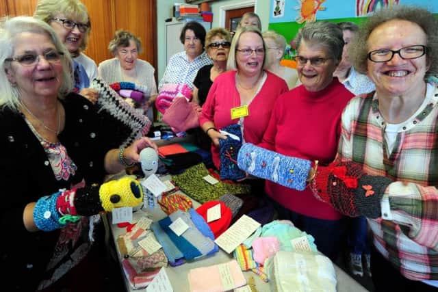 Members of the Arcade Knitters in Littlehampton with some of their work for charity. Picture: Kate Shemilt